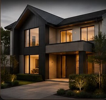 Modern detached home lit at dusk